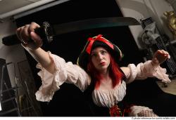 DARINA KNEELING POSES WITH DAGGER 